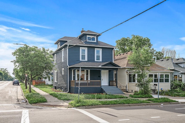 598 Western Ave N, Saint Paul, MN 55103 - traditional style home featuring a porch and a chimney