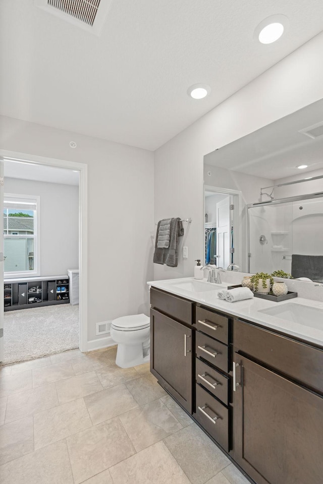 7237 Ada Dr, Lino Lakes, MN 55038 - full bathroom featuring double vanity and a shower stall