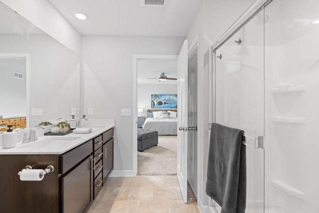 7237 Ada Dr, Lino Lakes, MN 55038 - bathroom featuring connected bathroom, double vanity, a stall shower, and a ceiling fan