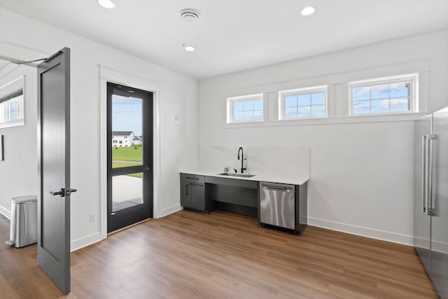 7237 Ada Dr, Lino Lakes, MN 55038 - bar area featuring appliances with stainless steel finishes, light wood-type flooring, and recessed lighting