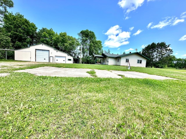 16033 Popplewood Rd NE, Hines Twp, MN 56647 - view of green lawn featuring a garage and an outbuilding