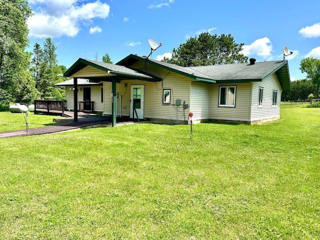 16033 Popplewood Rd NE, Hines Twp, MN 56647 - back of house featuring a lawn and a wooden deck