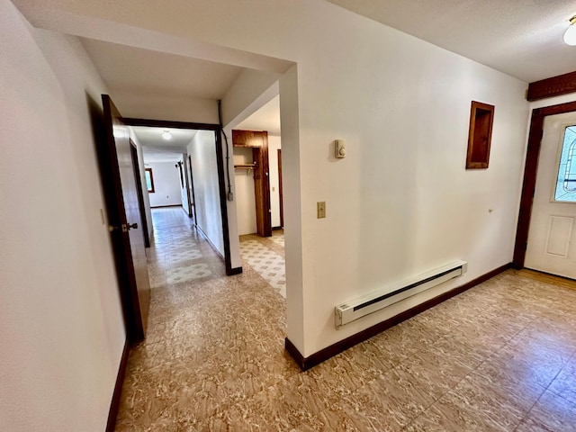 16033 Popplewood Rd NE, Hines Twp, MN 56647 - hallway featuring a baseboard radiator and tile patterned floors