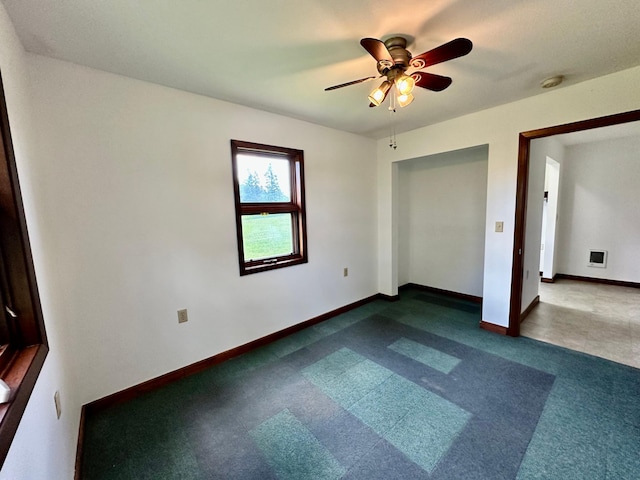 16033 Popplewood Rd NE, Hines Twp, MN 56647 - unfurnished bedroom featuring dark carpet, a ceiling fan, and a closet