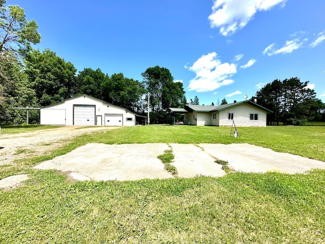 16033 Popplewood Rd NE, Hines Twp, MN 56647 - view of green lawn with a garage and an outbuilding