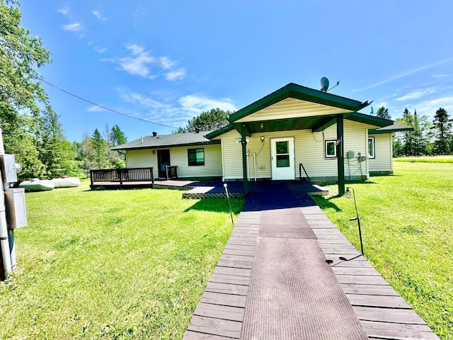 16033 Popplewood Rd NE, Hines Twp, MN 56647 - back of property with a yard, a deck, and driveway