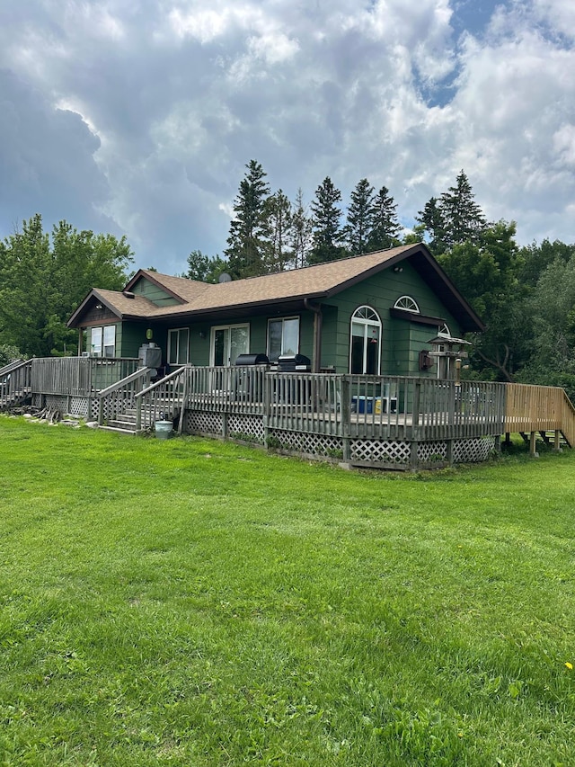 1374 State Highway 11 SE, Baudette, MN 56623 - single story home featuring a wooden deck and a front lawn