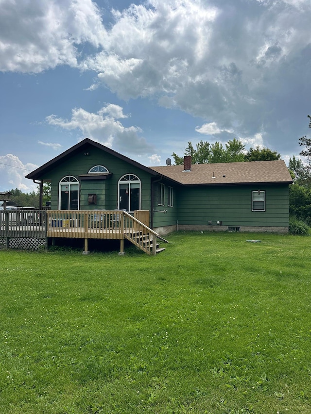 1374 State Highway 11 SE, Baudette, MN 56623 - back of property featuring a deck, a yard, and a chimney