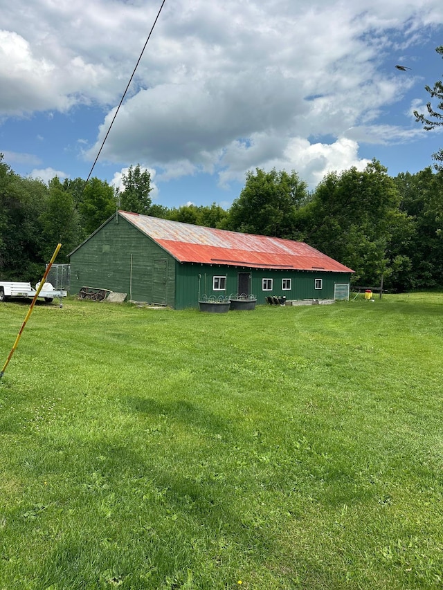 1374 State Highway 11 SE, Baudette, MN 56623 - back of house featuring an outbuilding, a lawn, and an outdoor structure