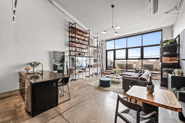 730 Stinson Blvd Unit 504, Minneapolis, MN 55413 - living room featuring concrete floors and a towering ceiling