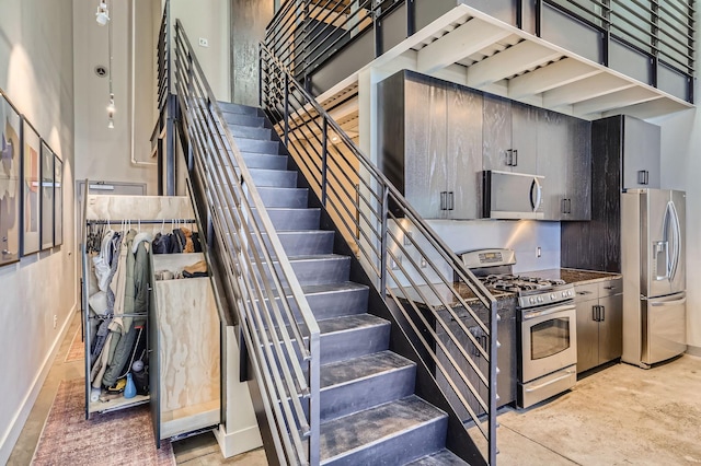 730 Stinson Blvd Unit 504, Minneapolis, MN 55413 - stairs with baseboards and a high ceiling