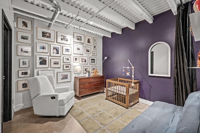 730 Stinson Blvd Unit 504, Minneapolis, MN 55413 - bedroom with concrete flooring and beamed ceiling