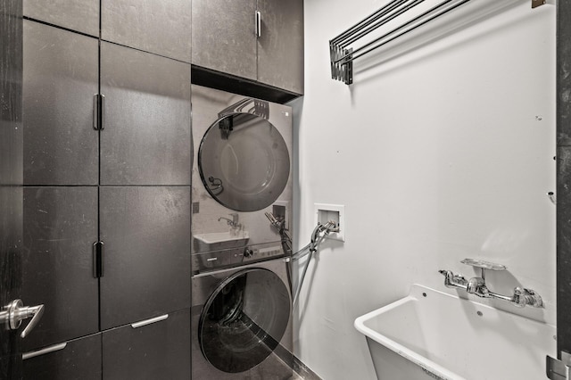 730 Stinson Blvd Unit 504, Minneapolis, MN 55413 - laundry area with stacked washer / drying machine and cabinet space