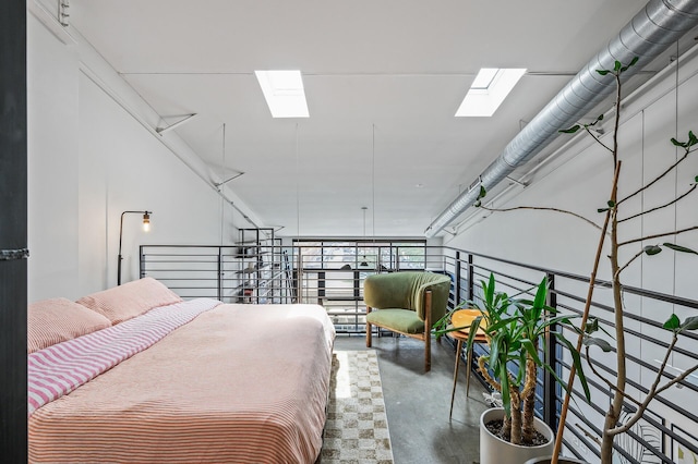 730 Stinson Blvd Unit 504, Minneapolis, MN 55413 - bedroom featuring a skylight and concrete floors