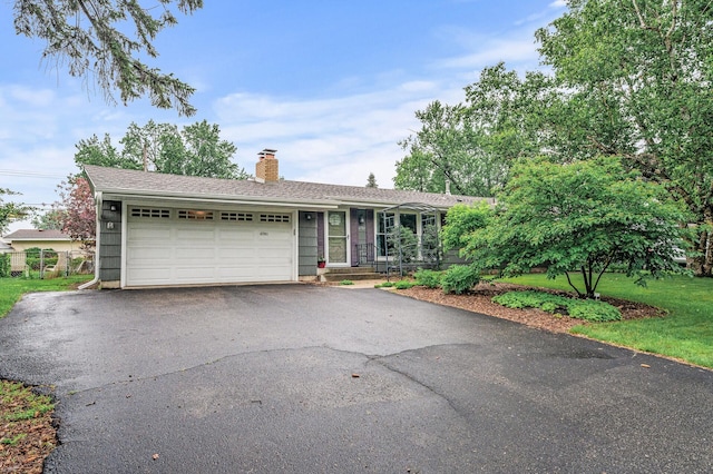 6781 Plaza Curv NE, Fridley, MN 55432 - ranch-style house featuring driveway, a chimney, and an attached garage