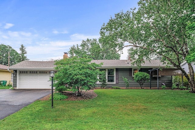 6781 Plaza Curv NE, Fridley, MN 55432 - single story home featuring driveway, an attached garage, a front yard, a chimney, and roof with shingles
