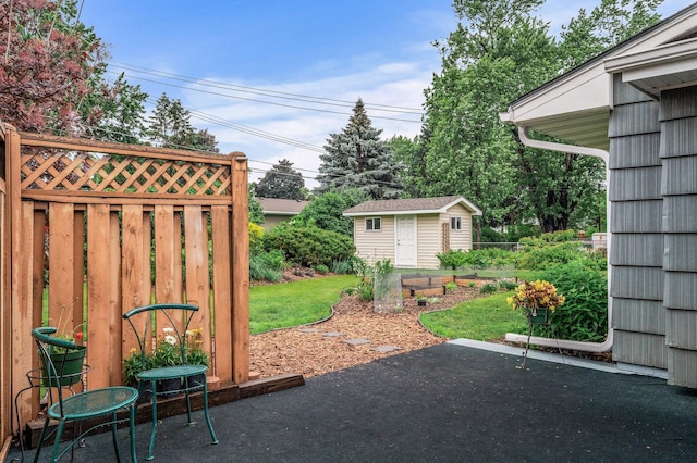 6781 Plaza Curv NE, Fridley, MN 55432 - view of yard featuring a patio area and a shed
