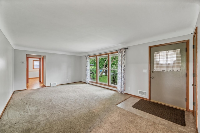 6781 Plaza Curv NE, Fridley, MN 55432 - entryway featuring light colored carpet and baseboards