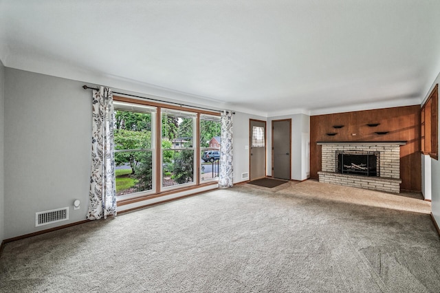 6781 Plaza Curv NE, Fridley, MN 55432 - unfurnished living room with a brick fireplace and carpet