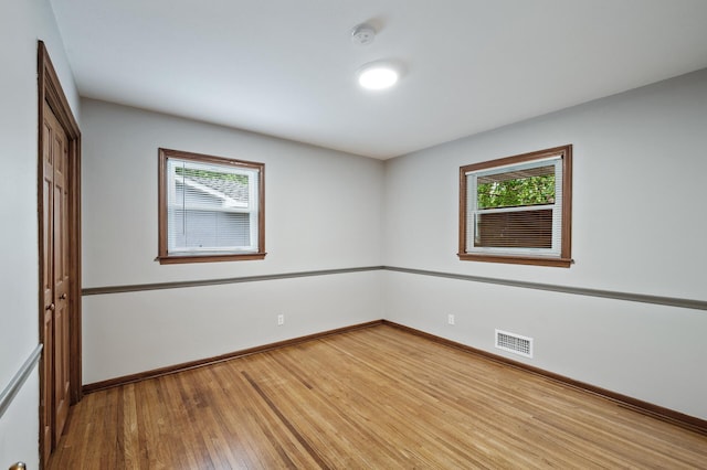 6781 Plaza Curv NE, Fridley, MN 55432 - empty room with a smoke detector and wood finished floors