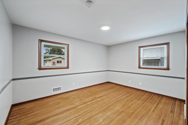 6781 Plaza Curv NE, Fridley, MN 55432 - spare room featuring wood finished floors and a smoke detector