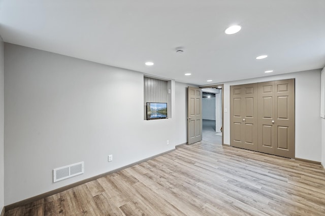 6781 Plaza Curv NE, Fridley, MN 55432 - unfurnished bedroom featuring light wood-style floors, recessed lighting, and a closet