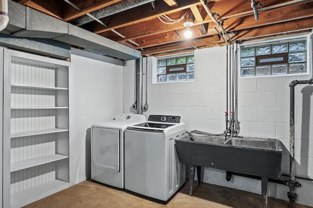 6781 Plaza Curv NE, Fridley, MN 55432 - laundry area with washer and dryer, concrete block wall, and plenty of natural light