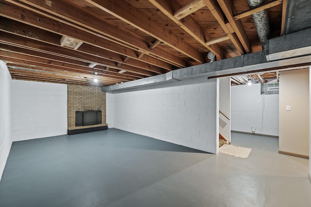 6781 Plaza Curv NE, Fridley, MN 55432 - finished below grade area with a fireplace, stairs, and concrete block wall