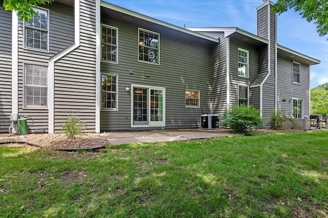 16503 Biscayne Blvd, Eden Prairie, MN 55347 - rear view of property with a chimney, a lawn, and a patio