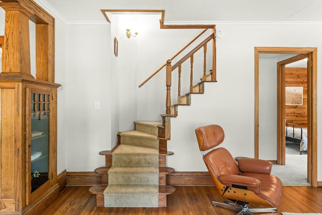 784 Fairview Ave N, Saint Paul, MN 55104 - stairs featuring wood finished floors and ornamental molding
