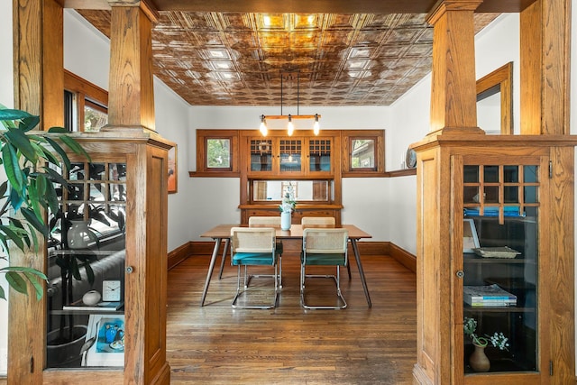 784 Fairview Ave N, Saint Paul, MN 55104 - dining area with wood finished floors, an ornate ceiling, and decorative columns