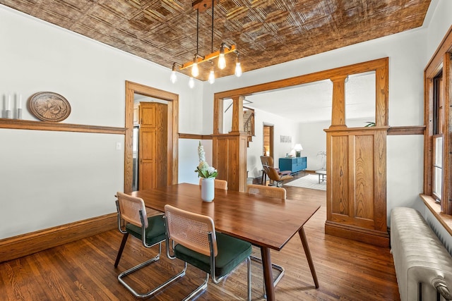 784 Fairview Ave N, Saint Paul, MN 55104 - dining room featuring radiator, an ornate ceiling, and wood-type flooring