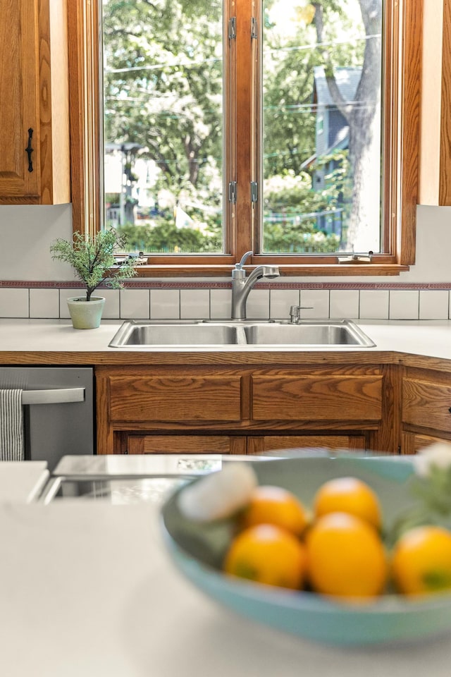 784 Fairview Ave N, Saint Paul, MN 55104 - kitchen featuring dishwasher, brown cabinetry, and light countertops