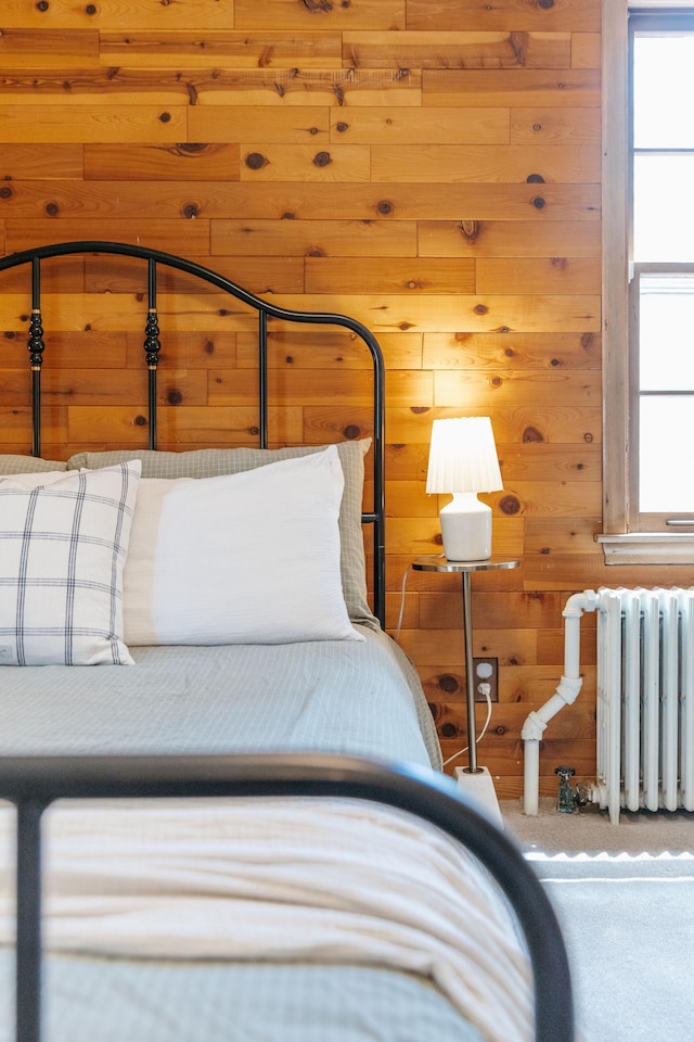 784 Fairview Ave N, Saint Paul, MN 55104 - carpeted bedroom featuring wood walls and radiator