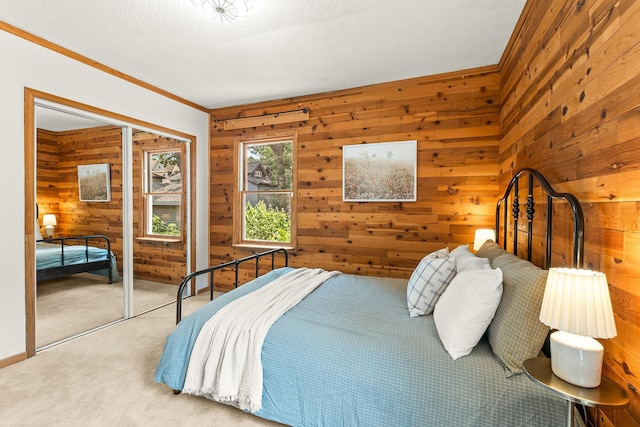 784 Fairview Ave N, Saint Paul, MN 55104 - bedroom featuring wooden walls, carpet flooring, crown molding, and a textured ceiling