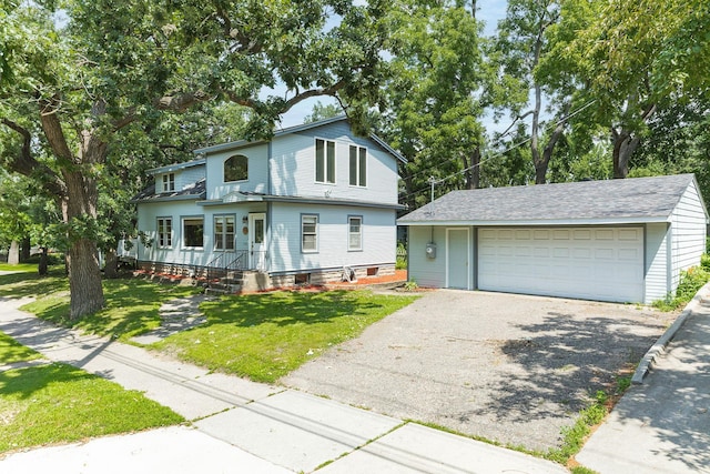 784 Fairview Ave N, Saint Paul, MN 55104 - view of front facade with an outbuilding, a garage, and a front yard