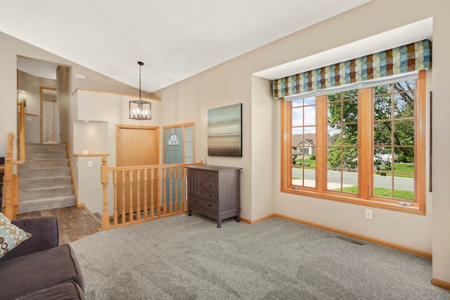 2174 Ponds Way, Shakopee, MN 55379 - unfurnished living room featuring carpet floors, a chandelier, lofted ceiling, and stairway