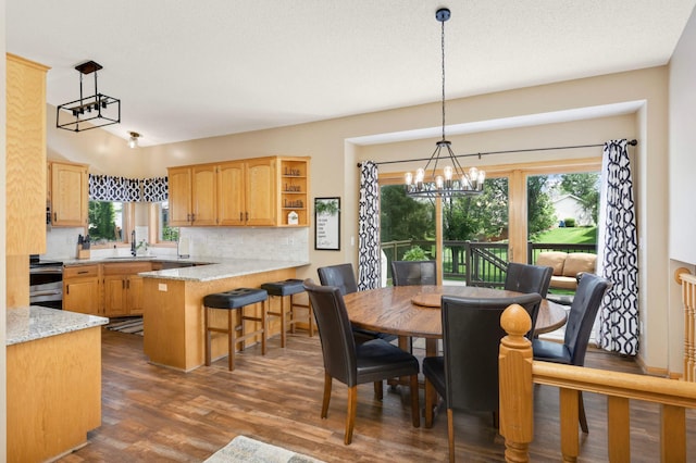 2174 Ponds Way, Shakopee, MN 55379 - dining space with dark wood-style floors and a chandelier