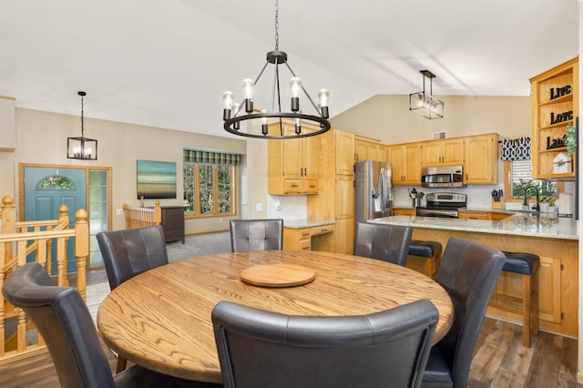 2174 Ponds Way, Shakopee, MN 55379 - dining space featuring a chandelier, healthy amount of natural light, dark wood finished floors, and high vaulted ceiling