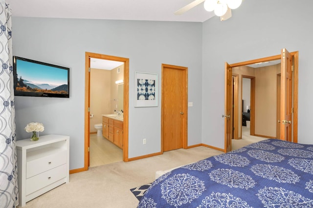 2174 Ponds Way, Shakopee, MN 55379 - bedroom featuring light colored carpet, ensuite bath, vaulted ceiling, and a ceiling fan