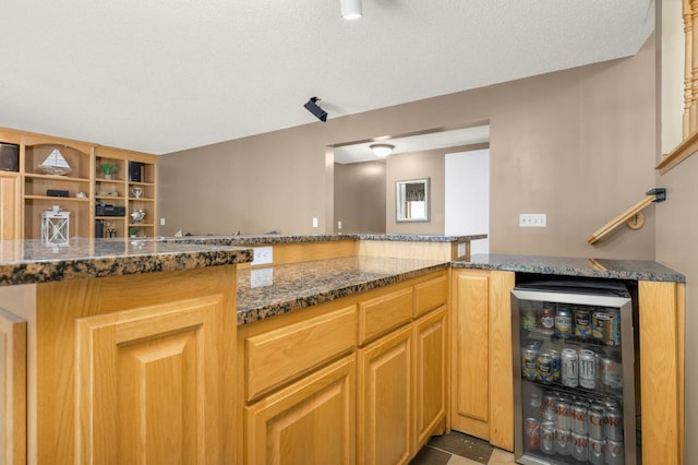 2174 Ponds Way, Shakopee, MN 55379 - kitchen with beverage cooler and dark stone countertops