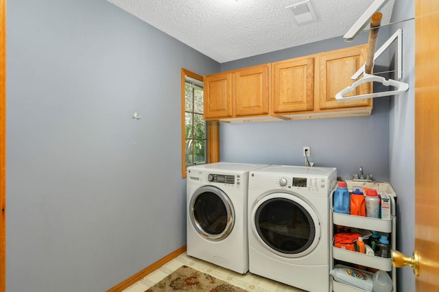 2174 Ponds Way, Shakopee, MN 55379 - laundry area featuring cabinet space, washing machine and dryer, and a textured ceiling