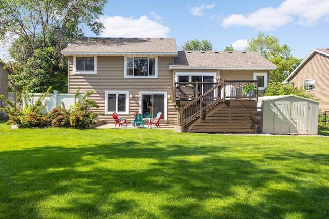 2174 Ponds Way, Shakopee, MN 55379 - back of house featuring a shed, a wooden deck, stairs, a patio area, and a shingled roof