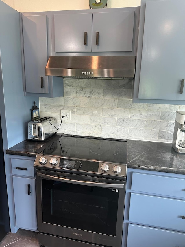 19 Sandbar Rd, Tracy, MN 56175 - kitchen featuring stainless steel electric range oven, wall chimney range hood, backsplash, and dark stone countertops