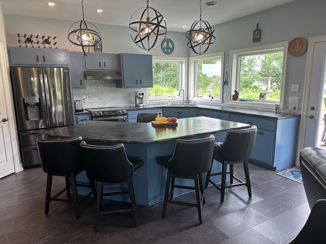 19 Sandbar Rd, Tracy, MN 56175 - kitchen featuring stainless steel appliances, under cabinet range hood, healthy amount of natural light, decorative backsplash, and recessed lighting