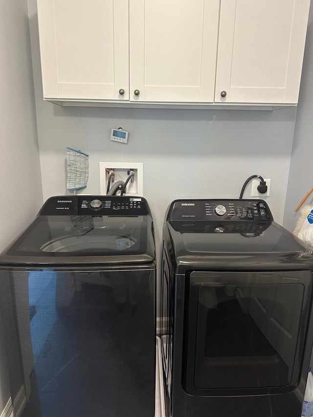 19 Sandbar Rd, Tracy, MN 56175 - laundry area featuring washer and clothes dryer and cabinet space