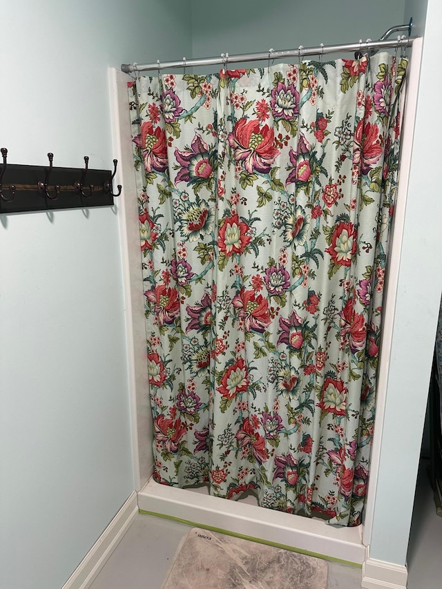 19 Sandbar Rd, Tracy, MN 56175 - bathroom with a stall shower and baseboards