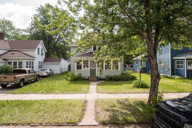 610 2nd St SW, Wadena, MN 56482 - obstructed view of property with entry steps, a front lawn, and a garage