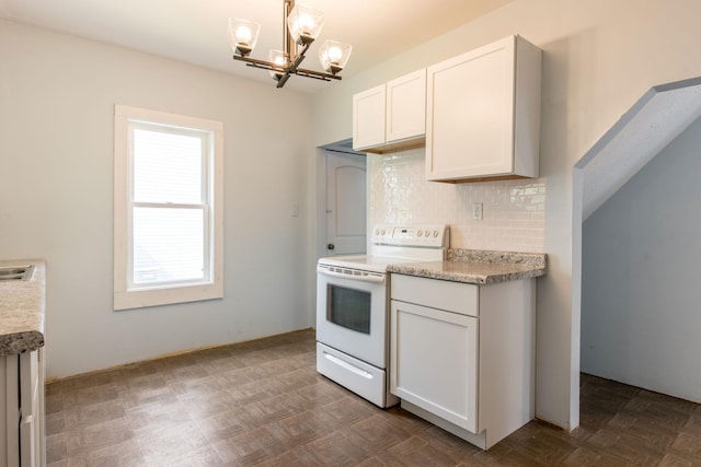 610 2nd St SW, Wadena, MN 56482 - kitchen featuring electric stove, a chandelier, backsplash, and light countertops