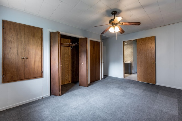 610 2nd St SW, Wadena, MN 56482 - unfurnished bedroom featuring carpet floors, multiple closets, and a ceiling fan